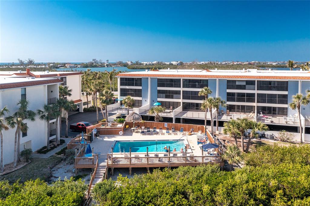 1591 Beach Road, Unit 403 Englewood, FL 34223 - Photo 41 of 61 an outdoor living area with seating space