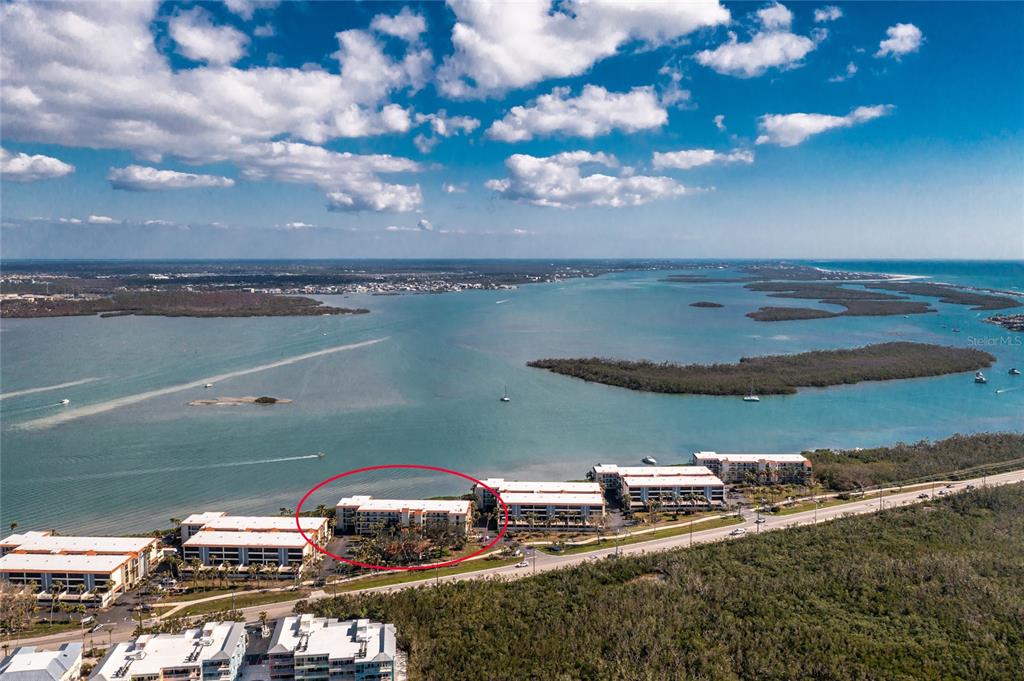 1591 Beach Road, Unit 403 Englewood, FL 34223 - Photo 48 of 61 a view of a lake with a car parked