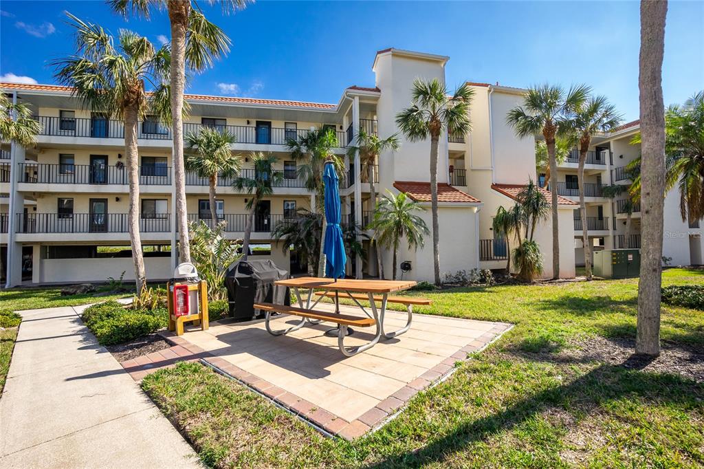 1591 Beach Road, Unit 403 Englewood, FL 34223 - Photo 6 of 61 a view of a house with backyard and sitting area