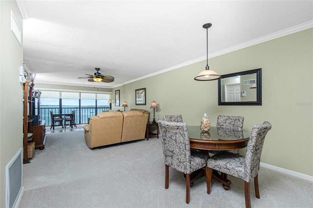 1591 Beach Road, Unit 403 Englewood, FL 34223 - Photo 8 of 61 a view of a dining room with furniture