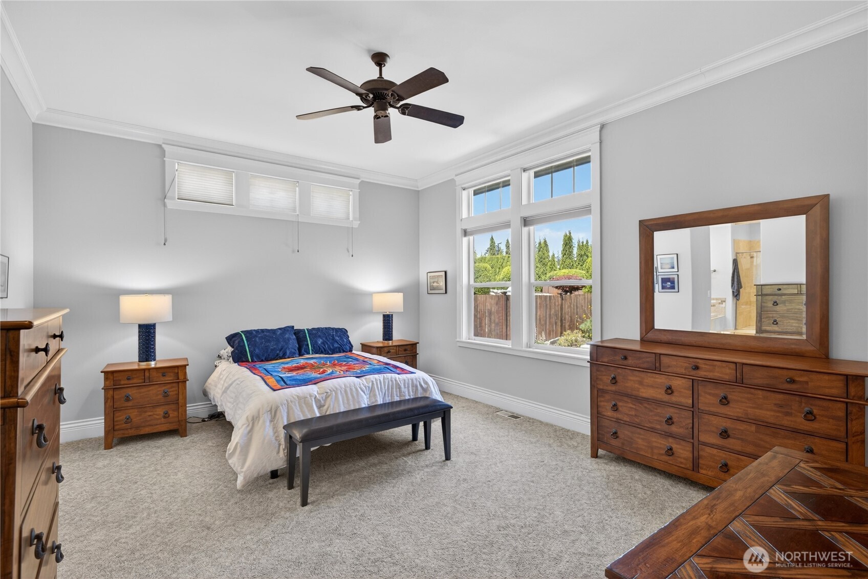1908 29th Place Anacortes, WA 98221 - Photo 31 of 40 a bedroom with a bed a chandelier and a window