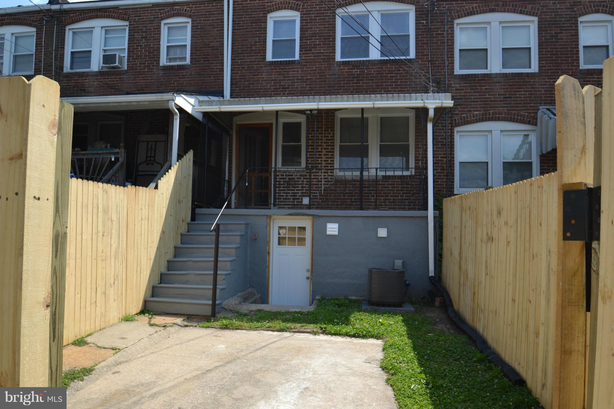 236 West Edgevale Road Baltimore, MD 21225 - Photo 30 of 30 a view of a brick house with brick walls and stairs