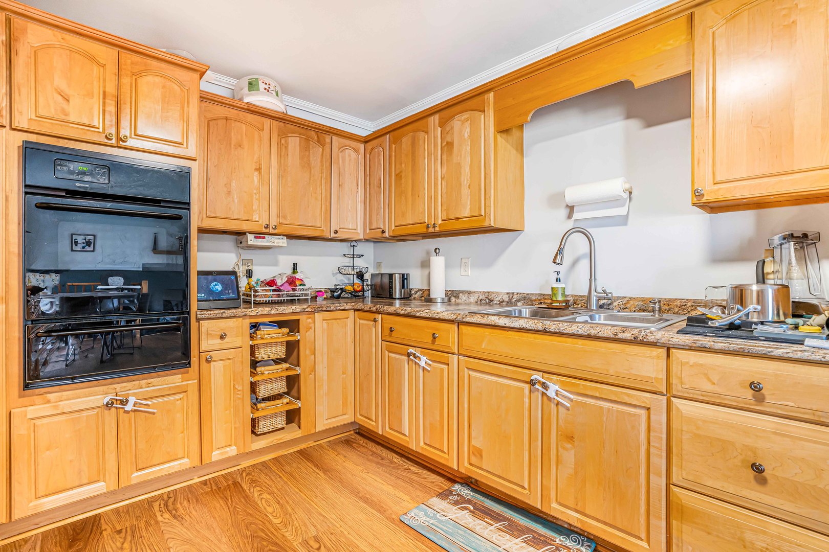 3542 191st Place Lansing, IL 60438 - Photo 4 of 18 a kitchen with granite countertop a sink stainless steel appliances and cabinets