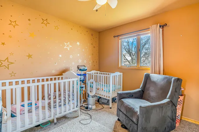 a bedroom with furniture and a window