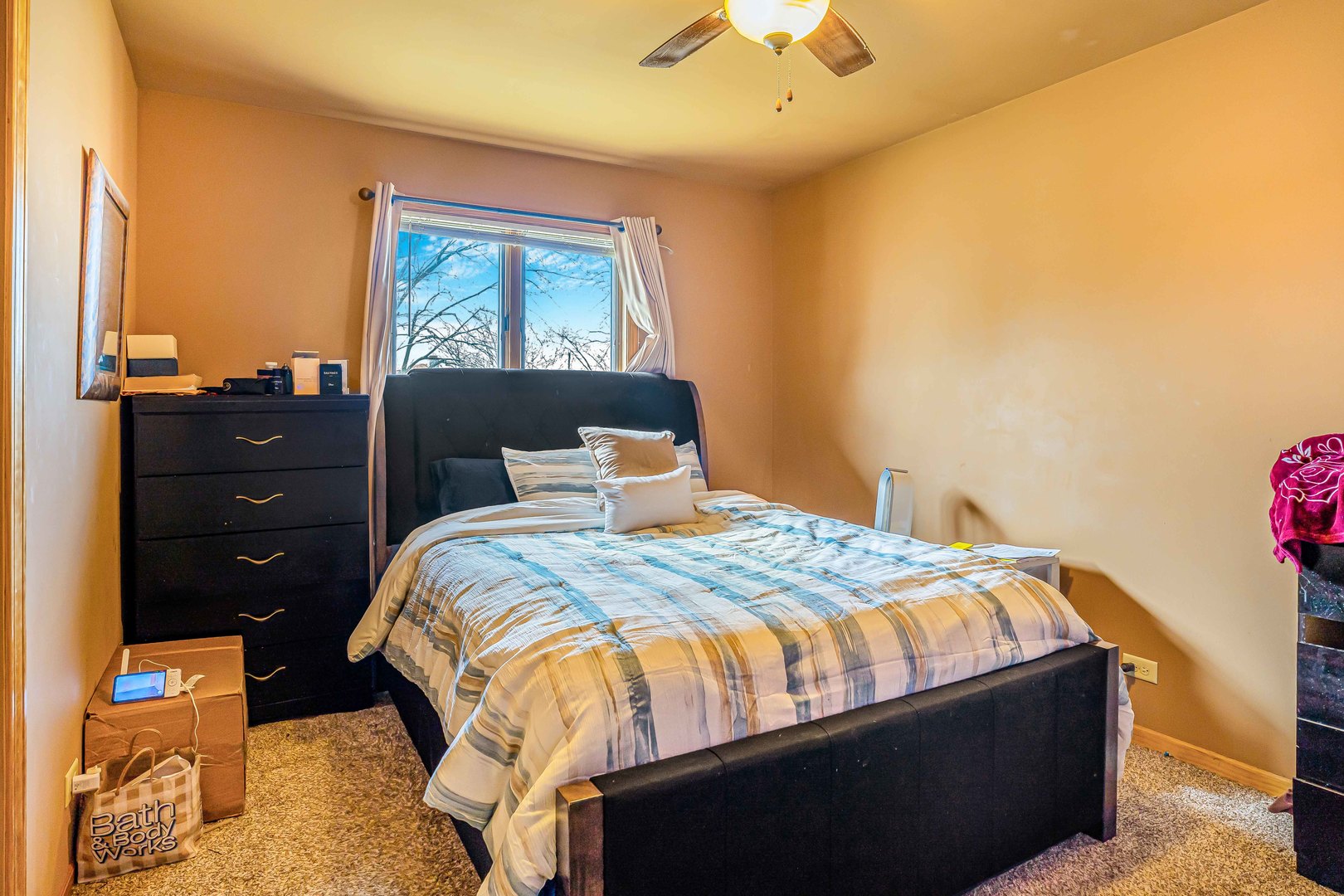3542 191st Place Lansing, IL 60438 - Photo 9 of 18 a bedroom with a bed and a window