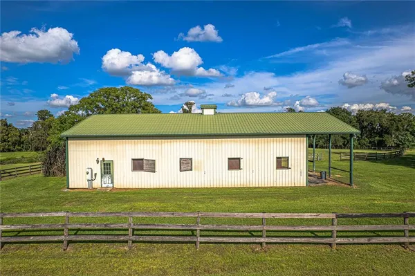 a view of a house with a big yard