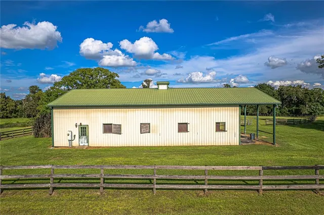 a view of a house with a big yard