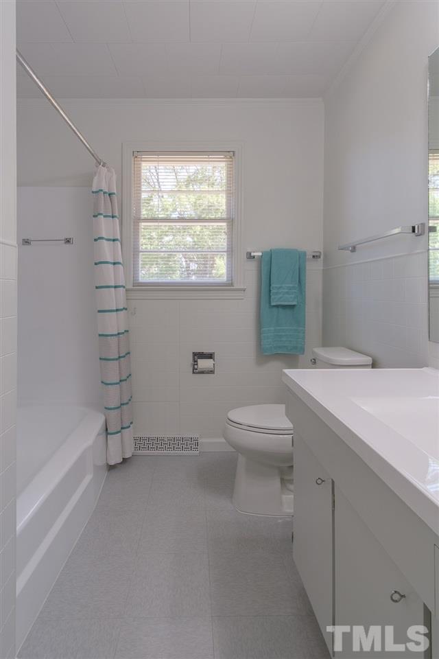 1301 Royster Clay Road Roxboro, NC 27574 - Photo 14 of 30 a bathroom with a toilet sink and shower