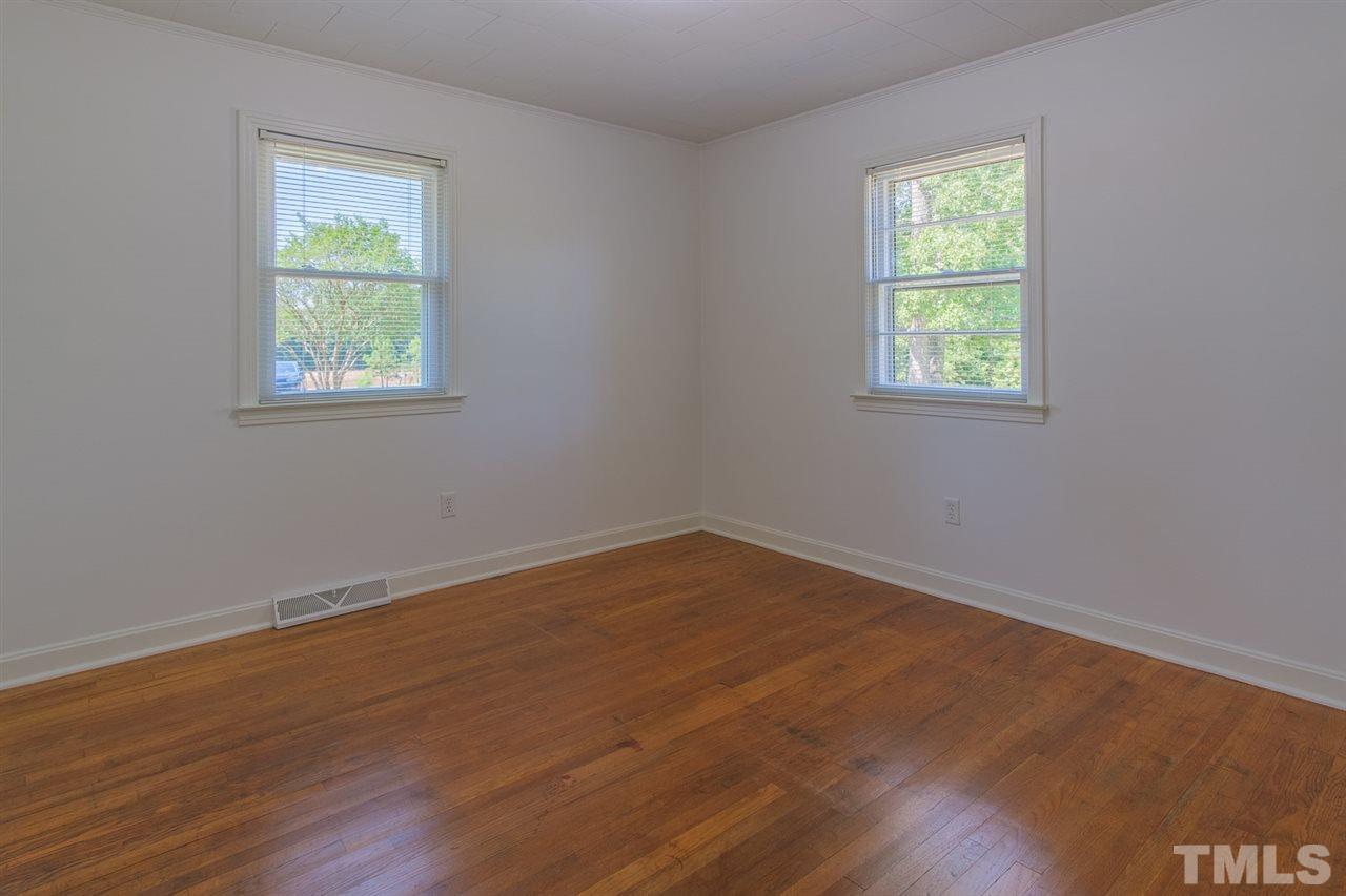 1301 Royster Clay Road Roxboro, NC 27574 - Photo 17 of 30 an empty room with a window