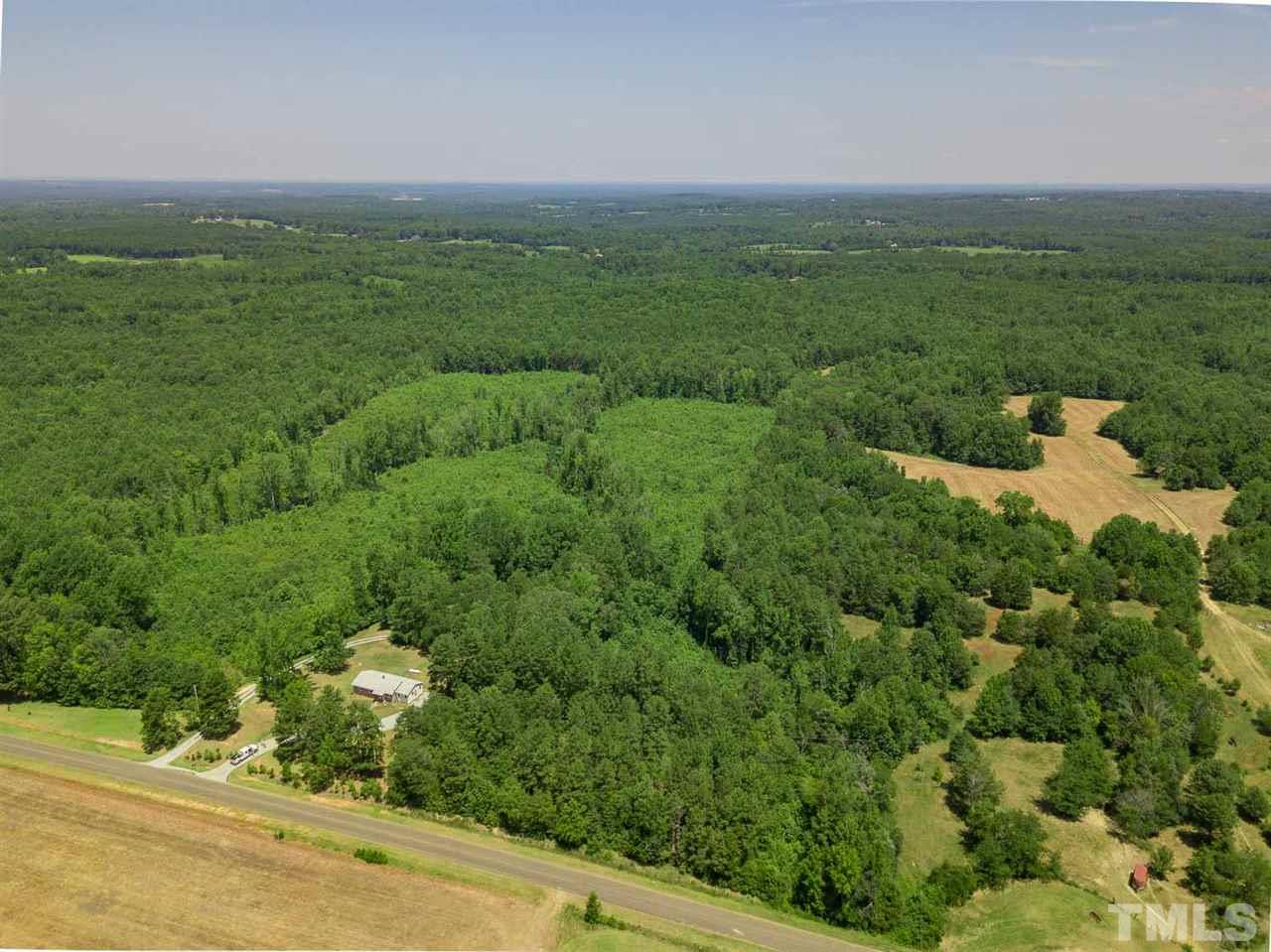 1301 Royster Clay Road Roxboro, NC 27574 - Photo 25 of 30 a view of a field with an ocean view