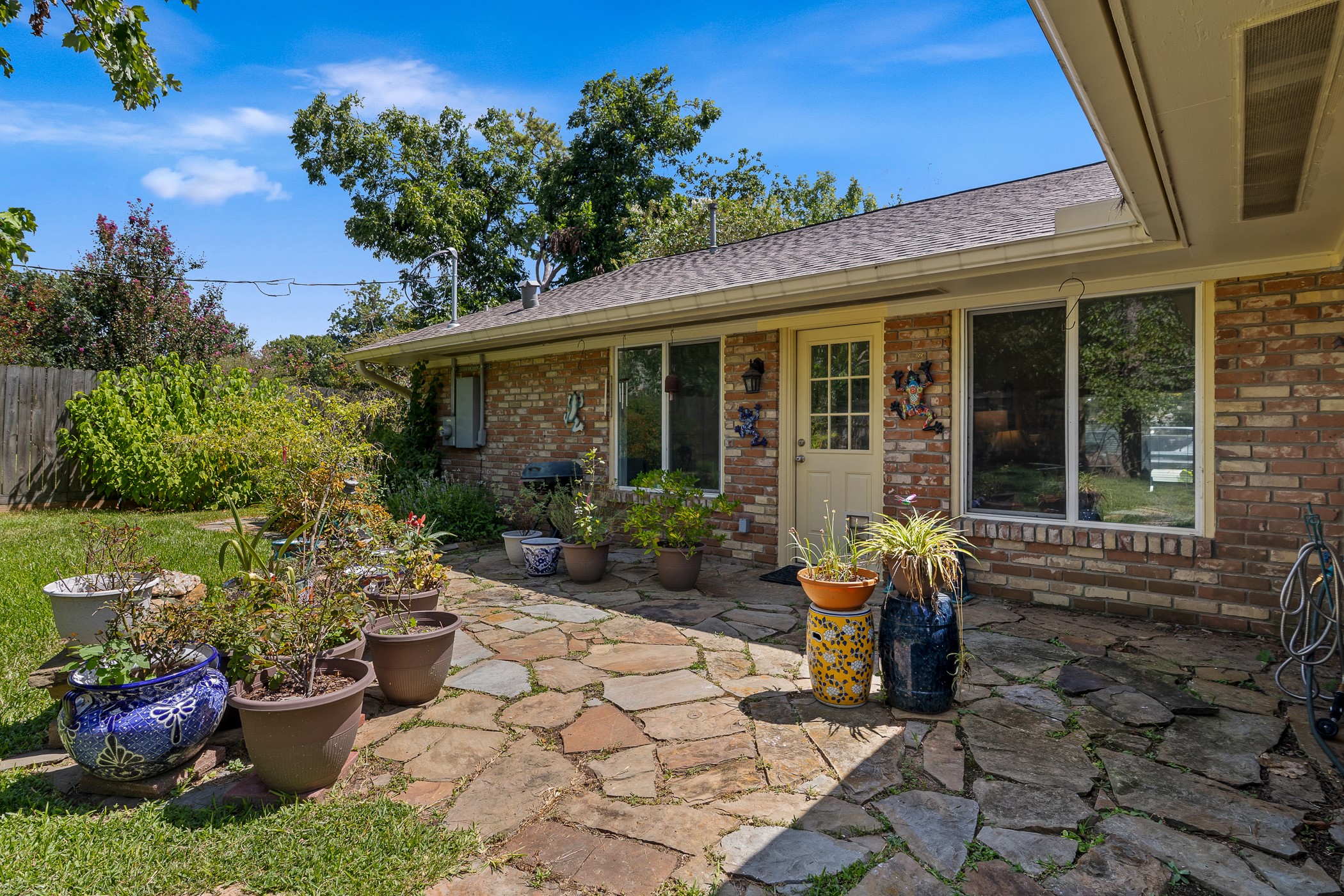 1427 Adkins Road Houston, TX 77055 - Photo 18 of 21 Backyard features a flagstone patio area perfect for outdoor dining and entertaining.