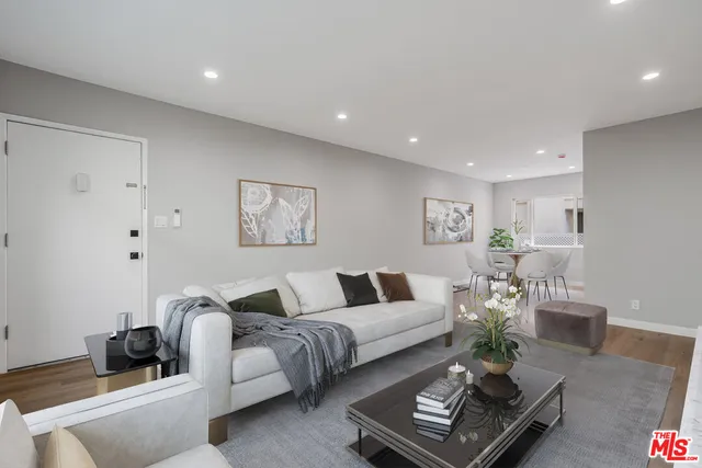 a living room with furniture rug and couch