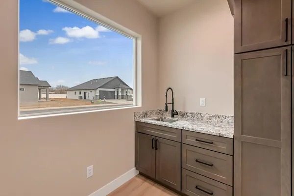 a view of walk in closet with cabinet