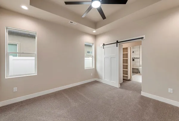 a view of an empty room and closet area