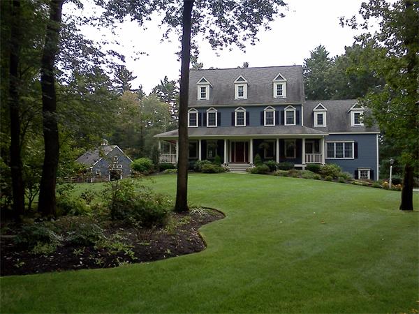 17 B Old Topsfield Road Boxford, MA 01921 - Photo 2 of 29 a front view of a house with a yard and trees