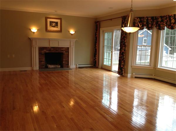 17 B Old Topsfield Road Boxford, MA 01921 - Photo 23 of 29 a view of a livingroom with wooden floor a fireplace and window