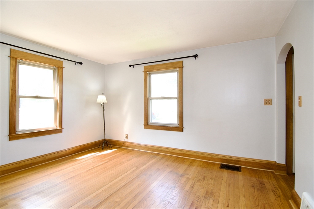67 Grandview Street Springfield, MA 01118 - Photo 8 of 42 a view of an empty room with wooden floor and a window