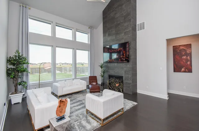 a living room with furniture and a fireplace