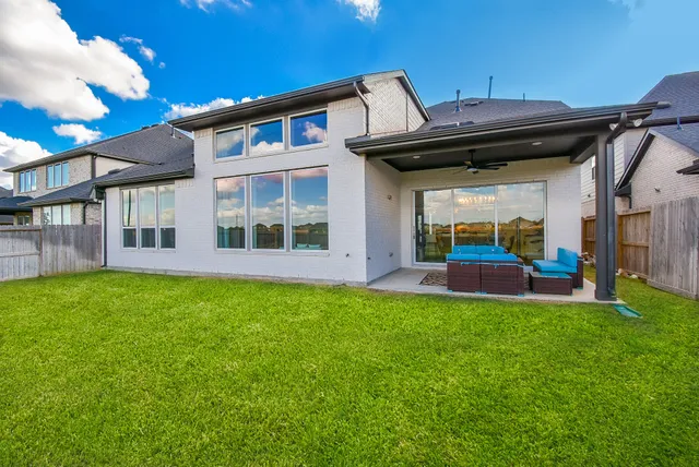a view of house with yard and porch