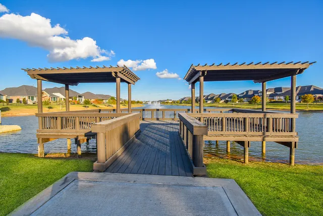 a view of a house with a yard and furniture