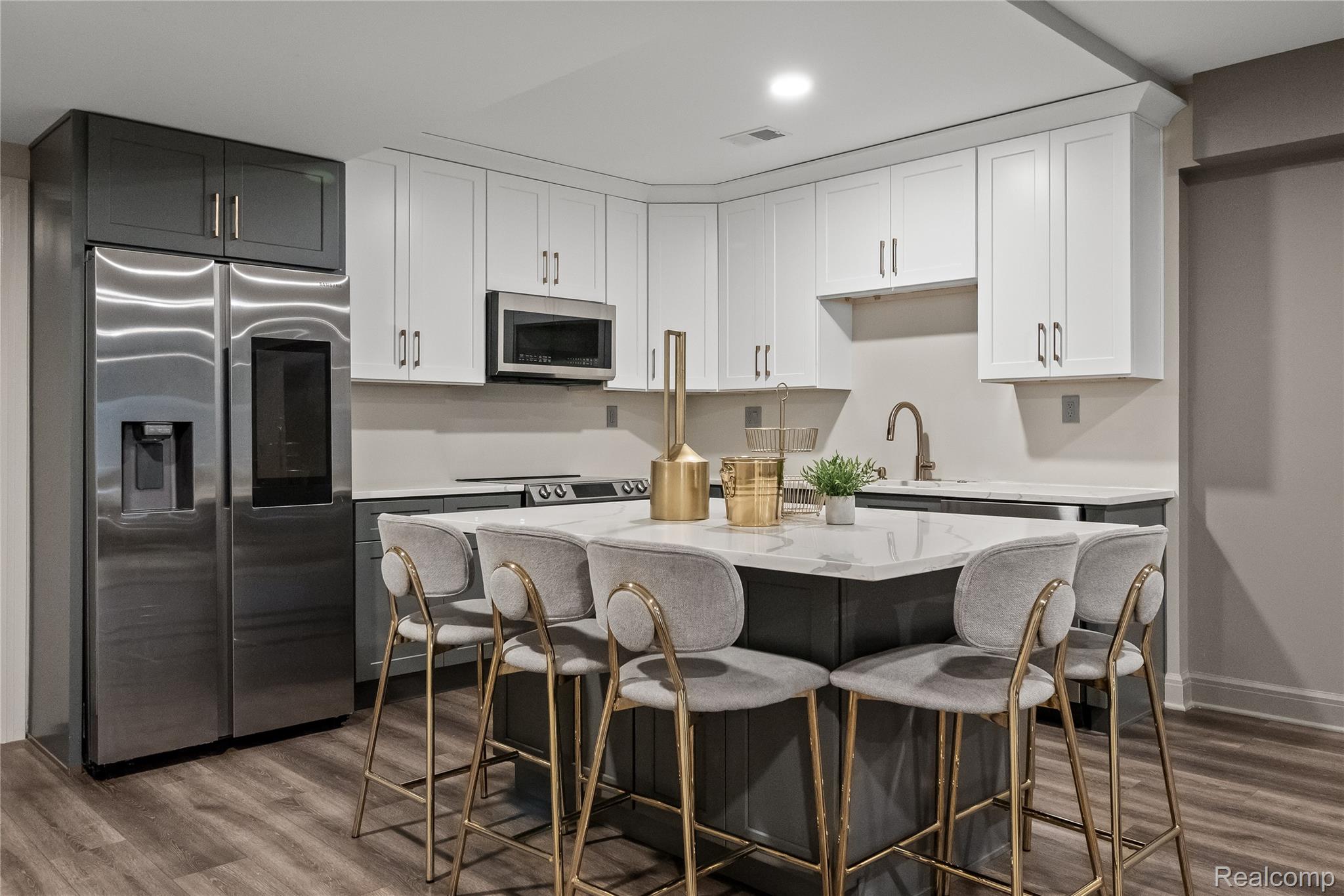 3824 Poppleton Street Troy, MI 48084 - Photo 36 of 51 Dual tone kitchen with two tone cabinetry, stainless steel appliances, light stone counters, a kitchen island, and dark wood-type flooring