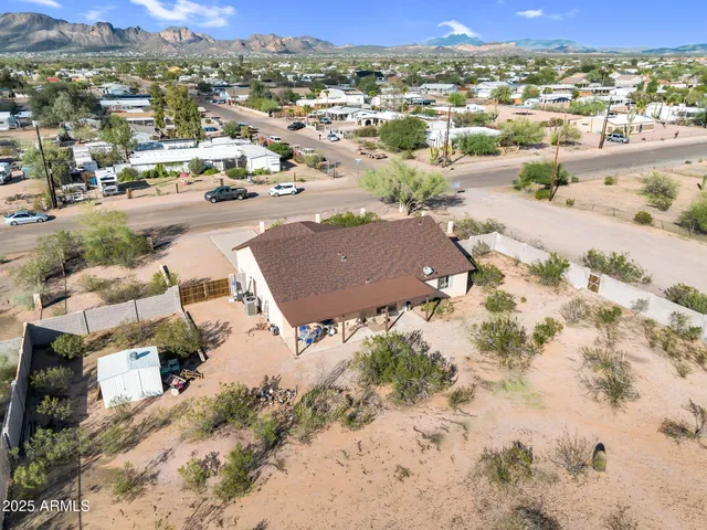 an aerial view of residential houses with outdoor space