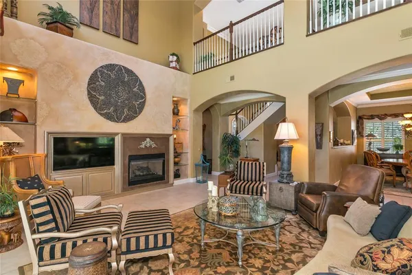 a dining table chairs in front of a house and wooden floor