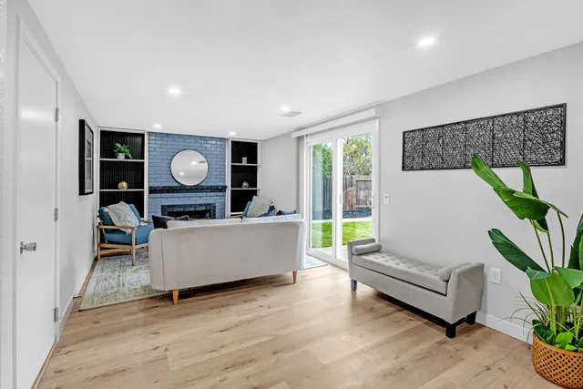 a backyard of a house with table and chairs