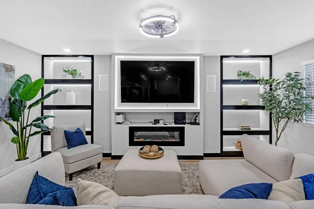 a kitchen with stainless steel appliances a stove sink and microwave