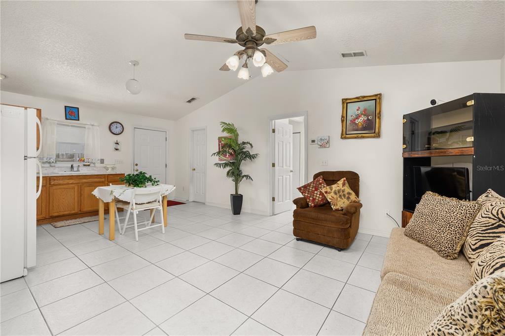 6907 Log Jam Court Ocoee, FL 34761 - Photo 17 of 30 a living room with furniture and a fireplace