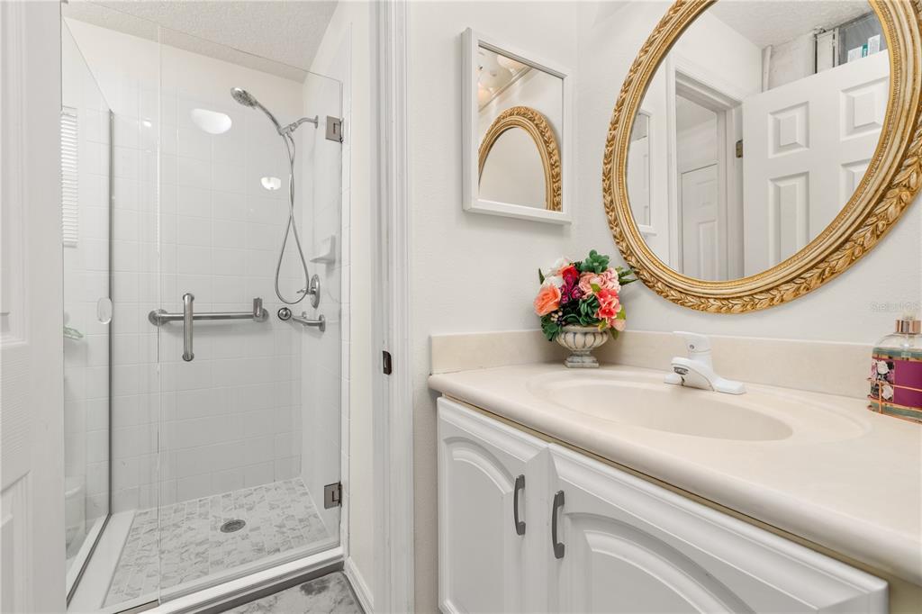 6907 Log Jam Court Ocoee, FL 34761 - Photo 24 of 30 a bathroom with a sink and a mirror