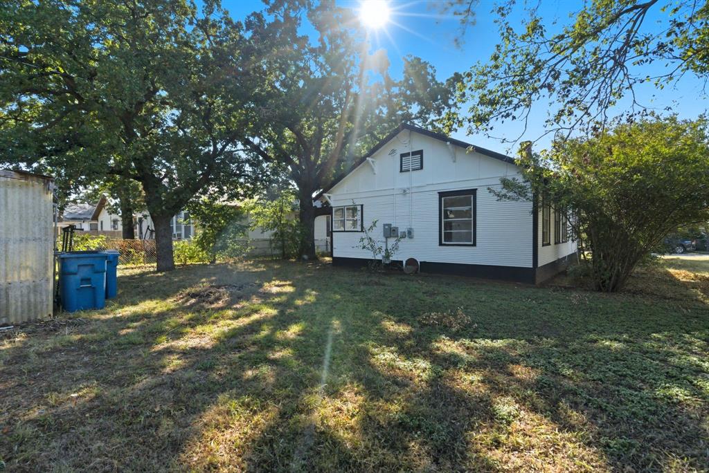709 East 23rd Street Cisco, TX 76437 - Photo 16 of 17 a view of a house with a yard