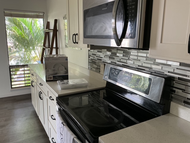 4121 Rice Street, Unit 402 Lihue, HI 96766 - Photo 3 of 20 a kitchen with a stove and a sink