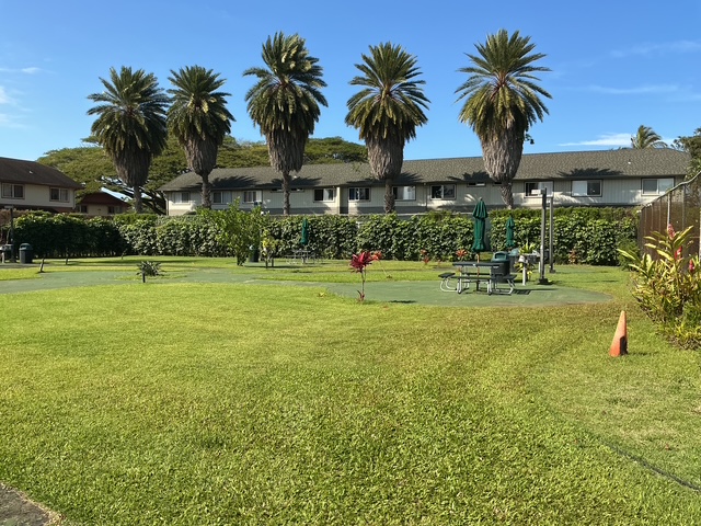 4121 Rice Street, Unit 402 Lihue, HI 96766 - Photo 6 of 20 a view of a palm trees in front of a house