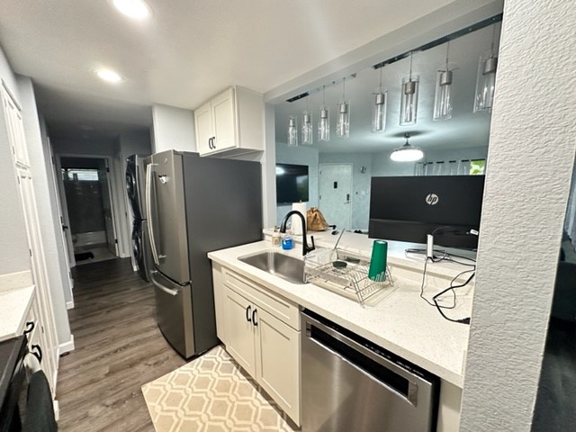 4121 Rice Street, Unit 402 Lihue, HI 96766 - Photo 7 of 20 a kitchen with stainless steel appliances granite countertop a refrigerator a sink and a stove