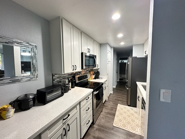 4121 Rice Street, Unit 402 Lihue, HI 96766 - Photo 10 of 20 a kitchen with a sink stove and refrigerator
