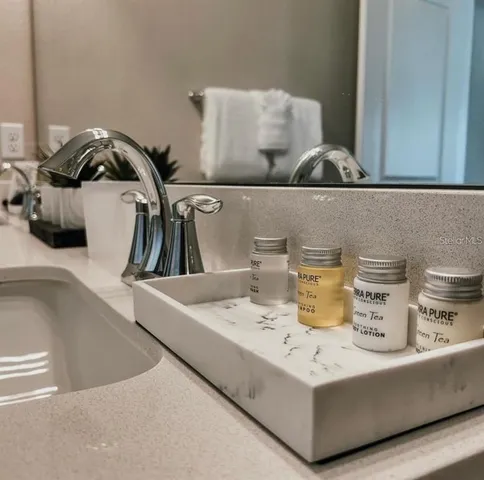 a view of living room with furniture and clutter