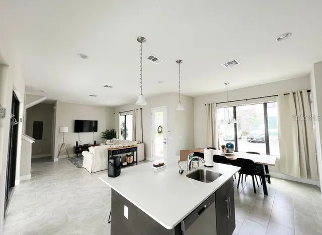 a view of a dining room with furniture window and outside view