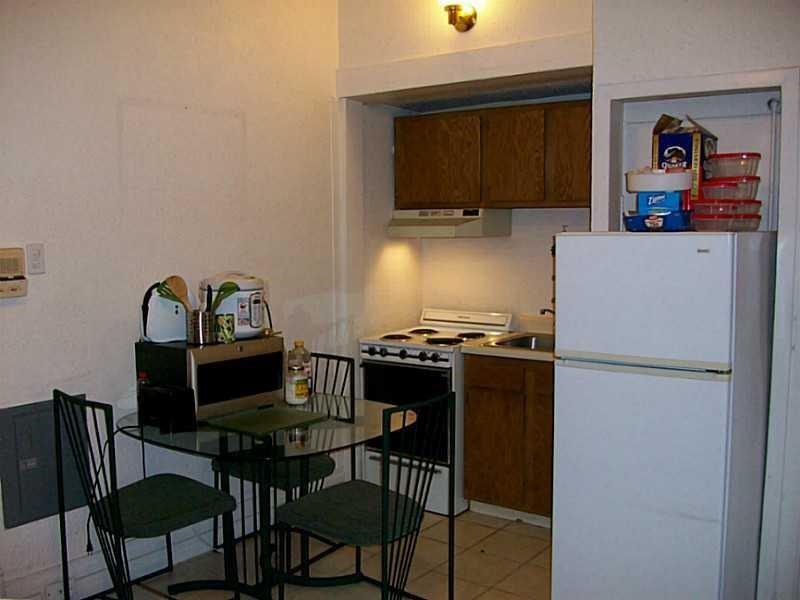 708 South Negley Avenue, Unit 4 Shadyside, PA 15232 - Photo 2 of 9 a kitchen with a stove and a refrigerator