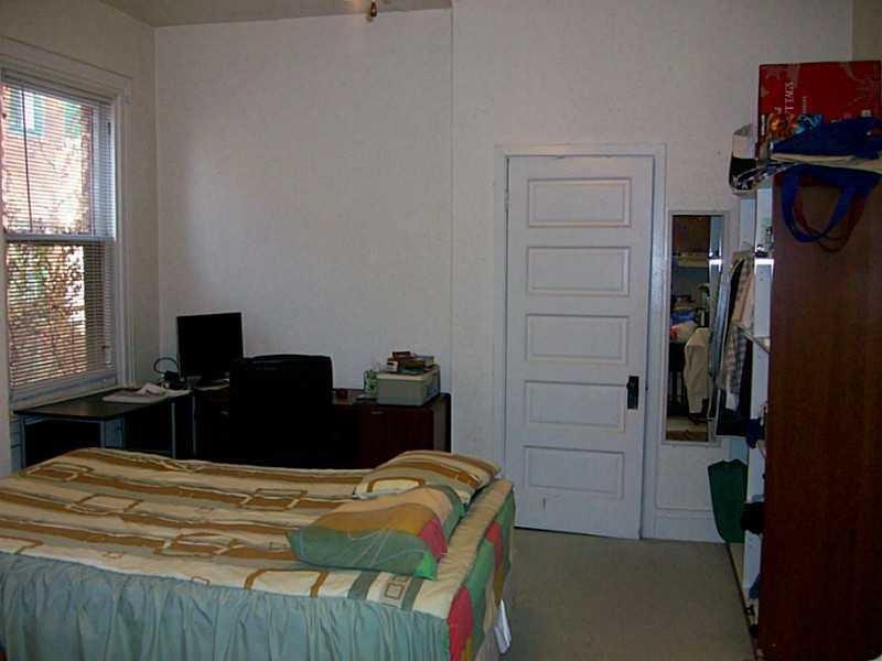 708 South Negley Avenue, Unit 4 Shadyside, PA 15232 - Photo 5 of 9 a bedroom with a bed and a window