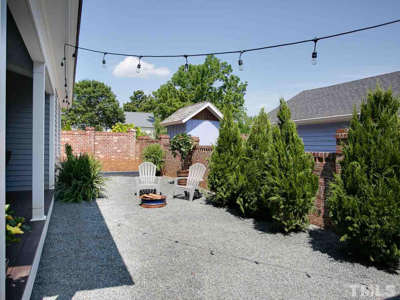 223 Elm Street Raleigh, NC 27601 - Photo 3 of 30 a view of a house with potted plants