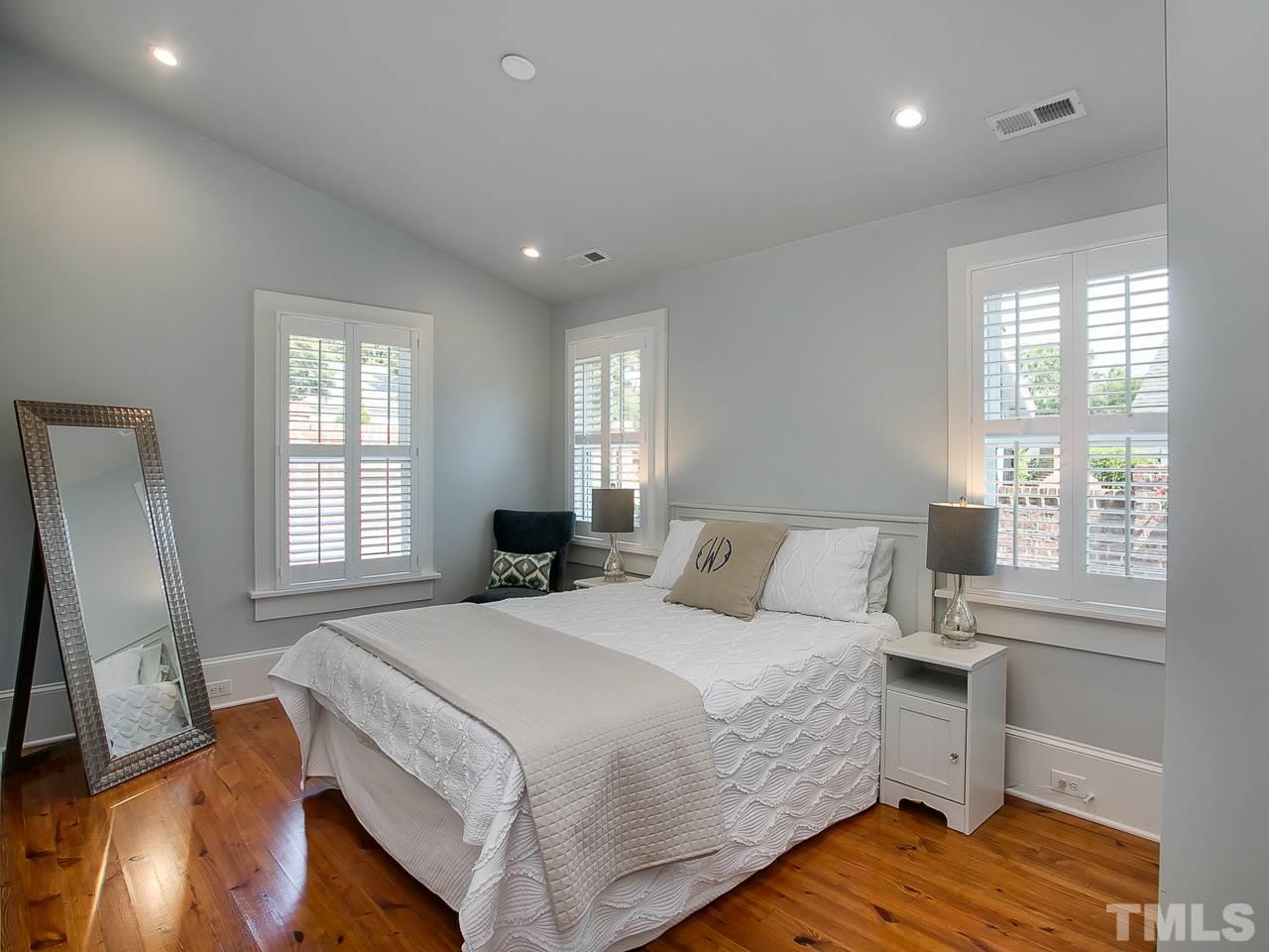 223 Elm Street Raleigh, NC 27601 - Photo 22 of 30 a bedroom with a bed and a window
