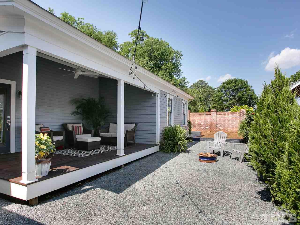 223 Elm Street Raleigh, NC 27601 - Photo 4 of 30 a patio with table and chairs and potted plants