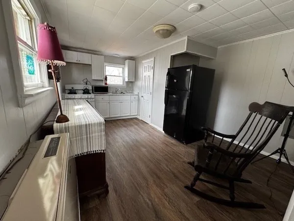 a view of kitchen with cabinets and wooden floor