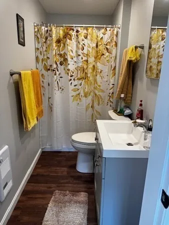 a bathroom with a sink toilet and shower