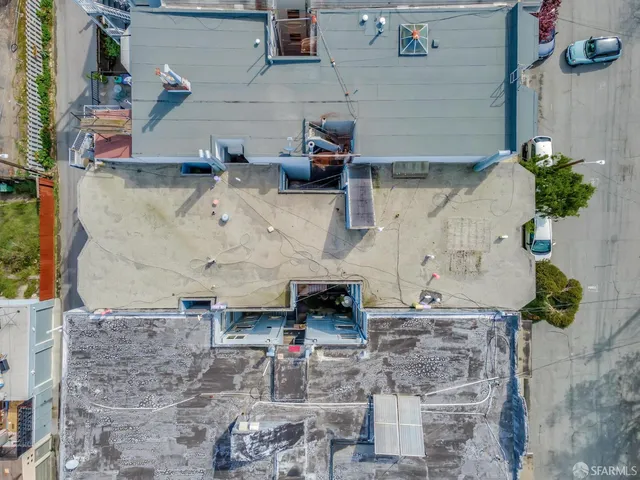 a aerial view of a houses with outdoor space