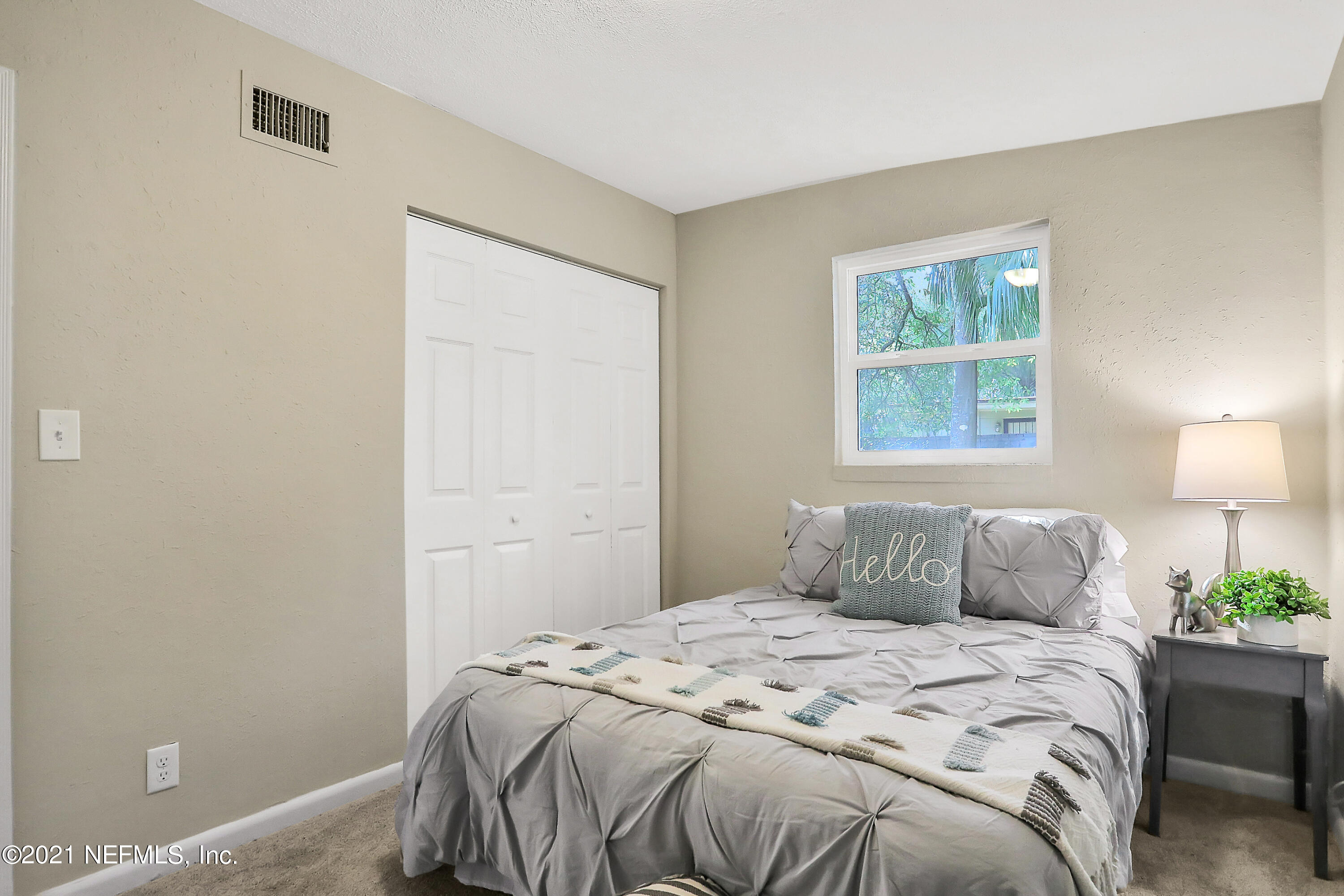 6823 Morgana Road North Jacksonville, FL 32211 - Photo 13 of 23 a bedroom with a bed and a window