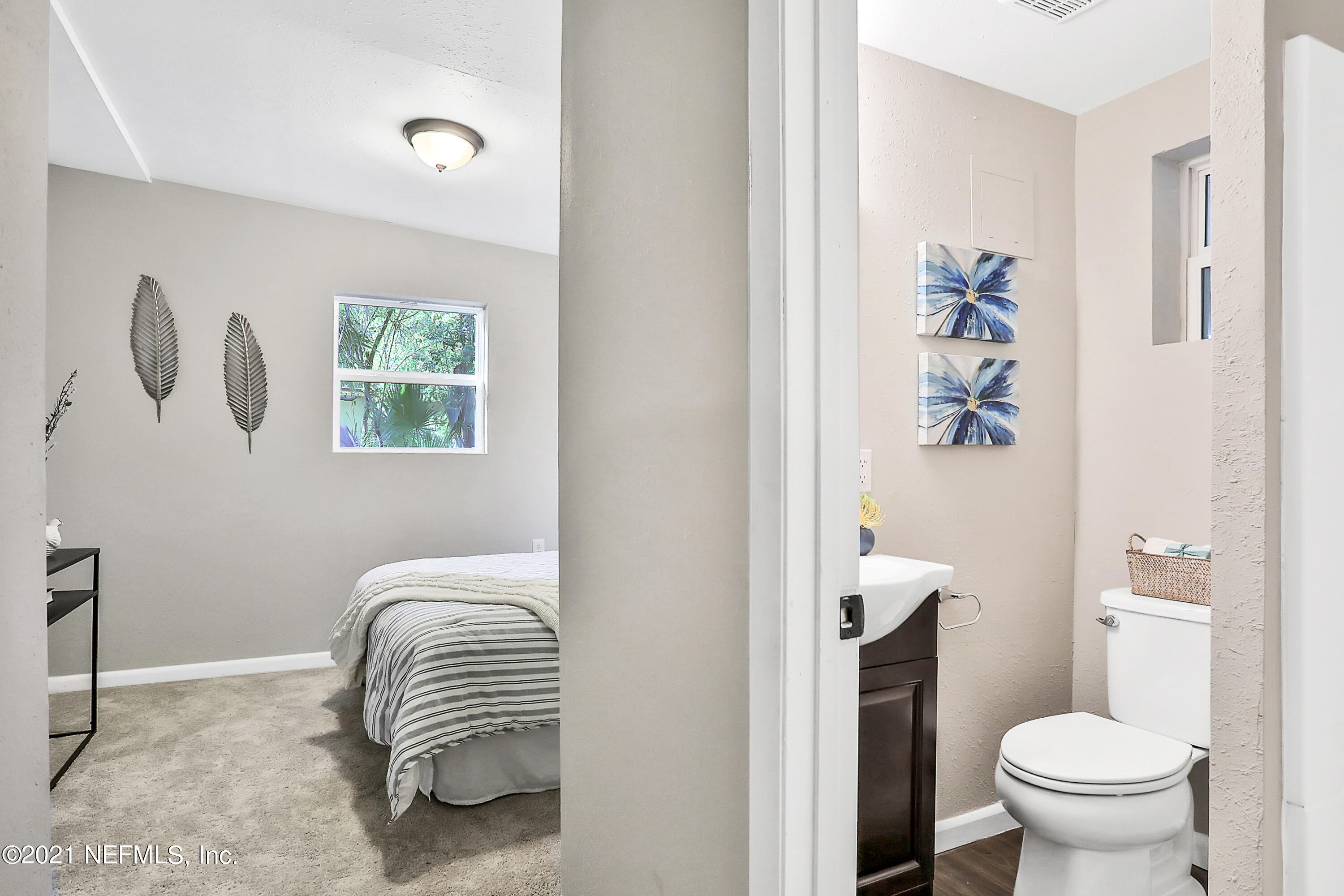 6823 Morgana Road North Jacksonville, FL 32211 - Photo 14 of 23 a bathroom with a sink and a toilet