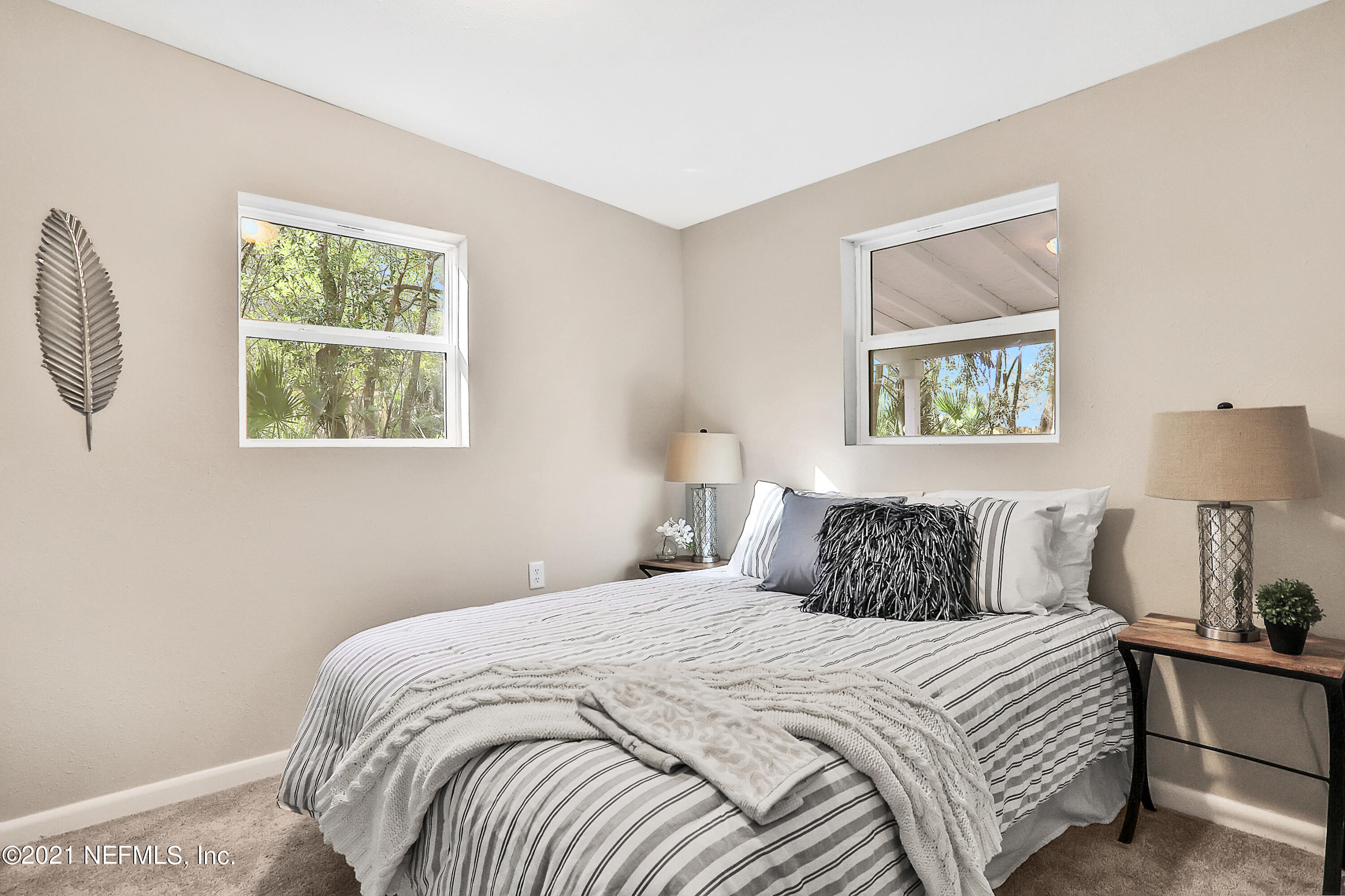 6823 Morgana Road North Jacksonville, FL 32211 - Photo 17 of 23 a bedroom with a bed and a window