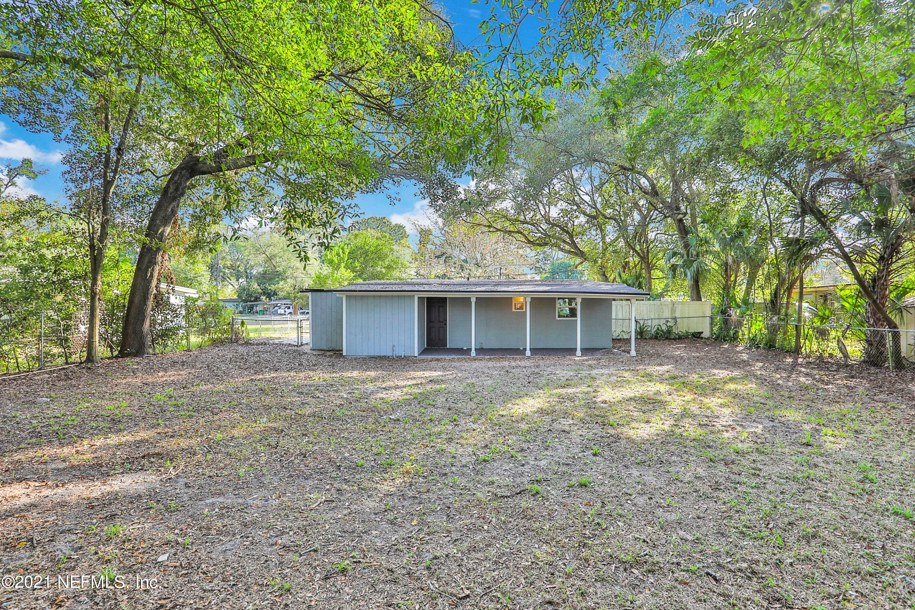 6823 Morgana Road North Jacksonville, FL 32211 - Photo 23 of 23 a house with trees in the background